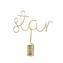 Gold wire sculpture spelling 'star' on a white background