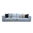 Ice blue sectional sofa with patterned cushions on a white background