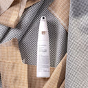 Textile and rug spot cleaner bottle on fabric background