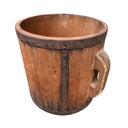 Wooden bucket with a handle on a white background