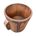 Wooden cup with handle on a white background