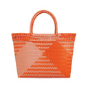 Woven orange and pink tote bag on a white background