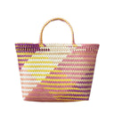 Colorful pink, purple, and yellow woven basket with a pattern on a white background