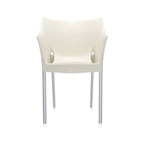 The front of a white wax Kartell armchair.