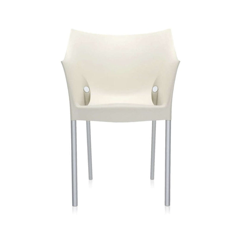 The front of a white wax Kartell armchair.