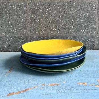 Side view of a ceramic family salad or pasta bowl in a Daffodil colour.