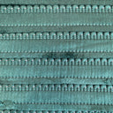 A close up of an emerald green cushion fringe.