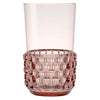 A pink transparent drinking cup by Kartell.
