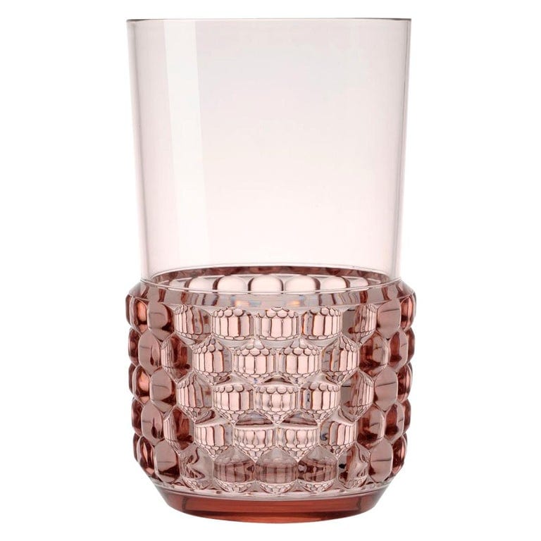 A pink transparent drinking cup by Kartell.