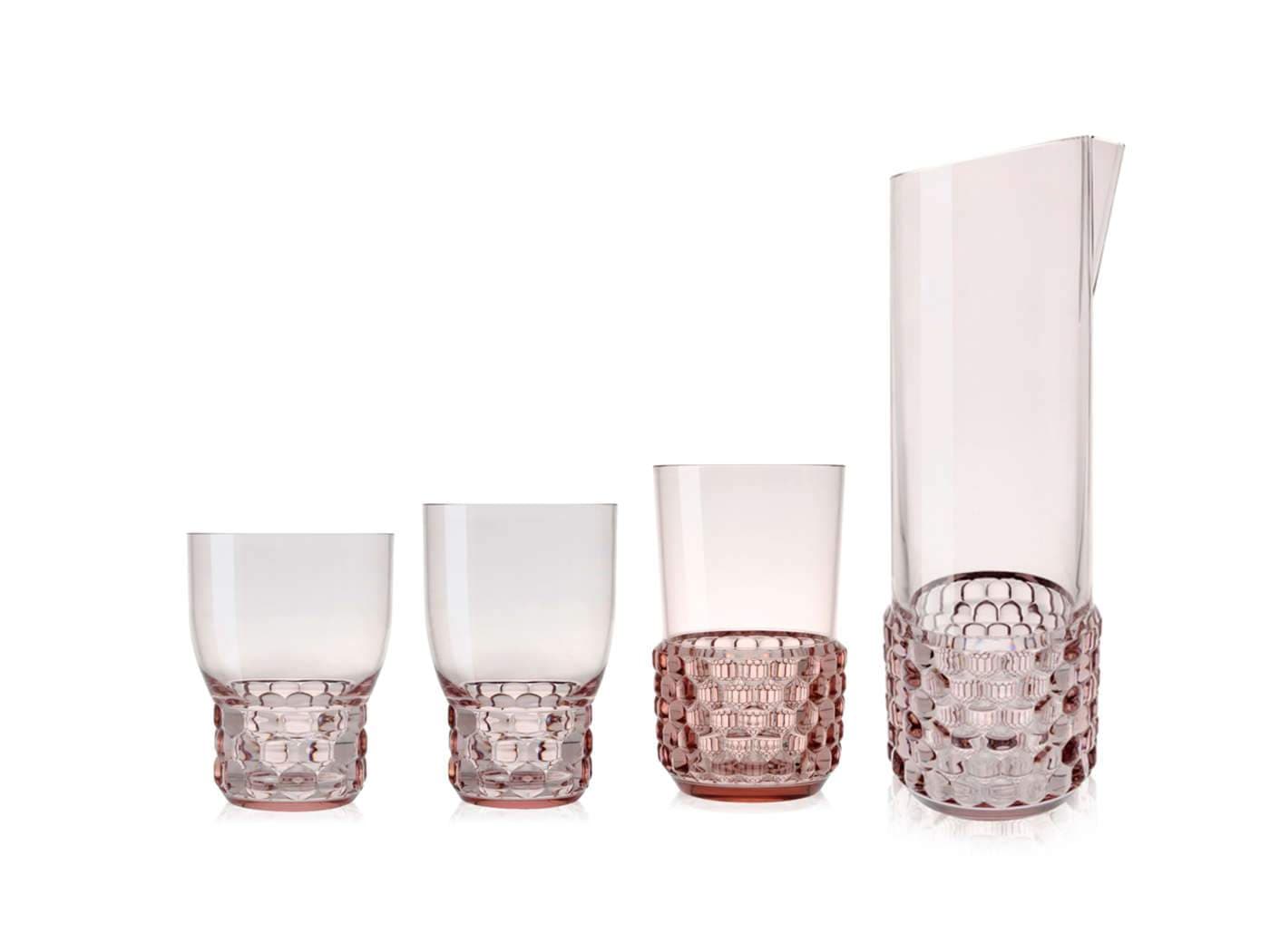 Three cups and one carafe in the pink jellies drinkware range by Kartell.