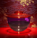 The Shibuya vase sitting on a red table.