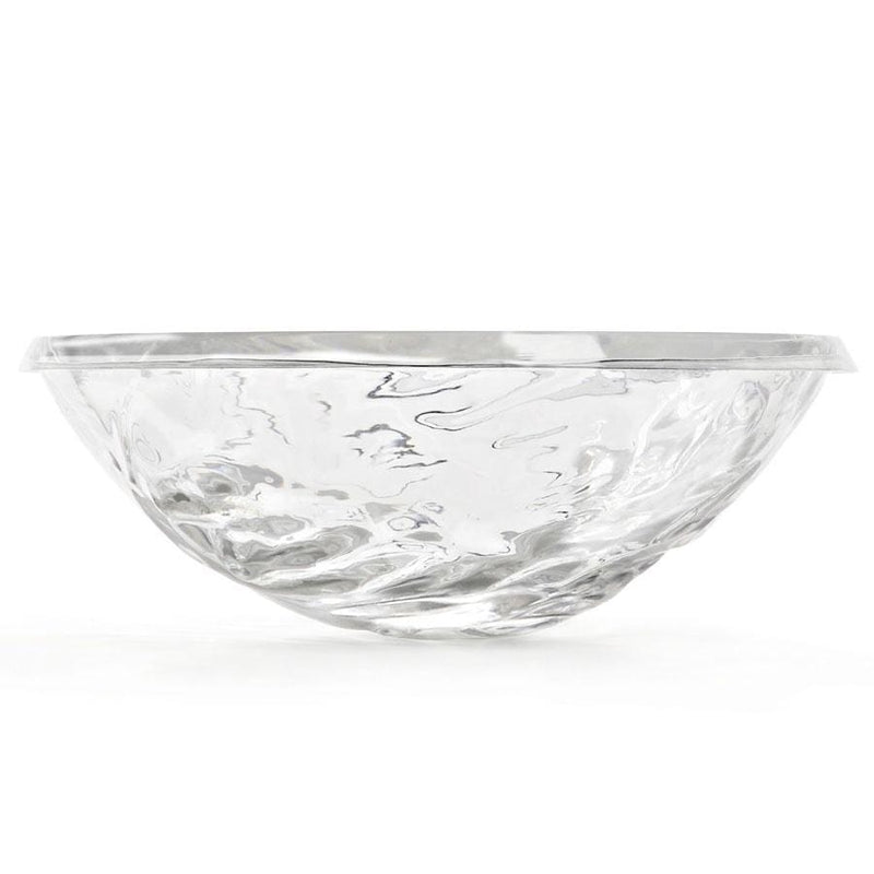 A clear plastic bowl by Kartell.