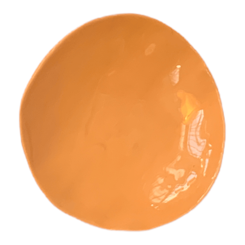 Birds eye view of a small orange ceramic bowl in the colour Cantelope.