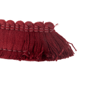The end of a burgundy coloured cushion fringe.