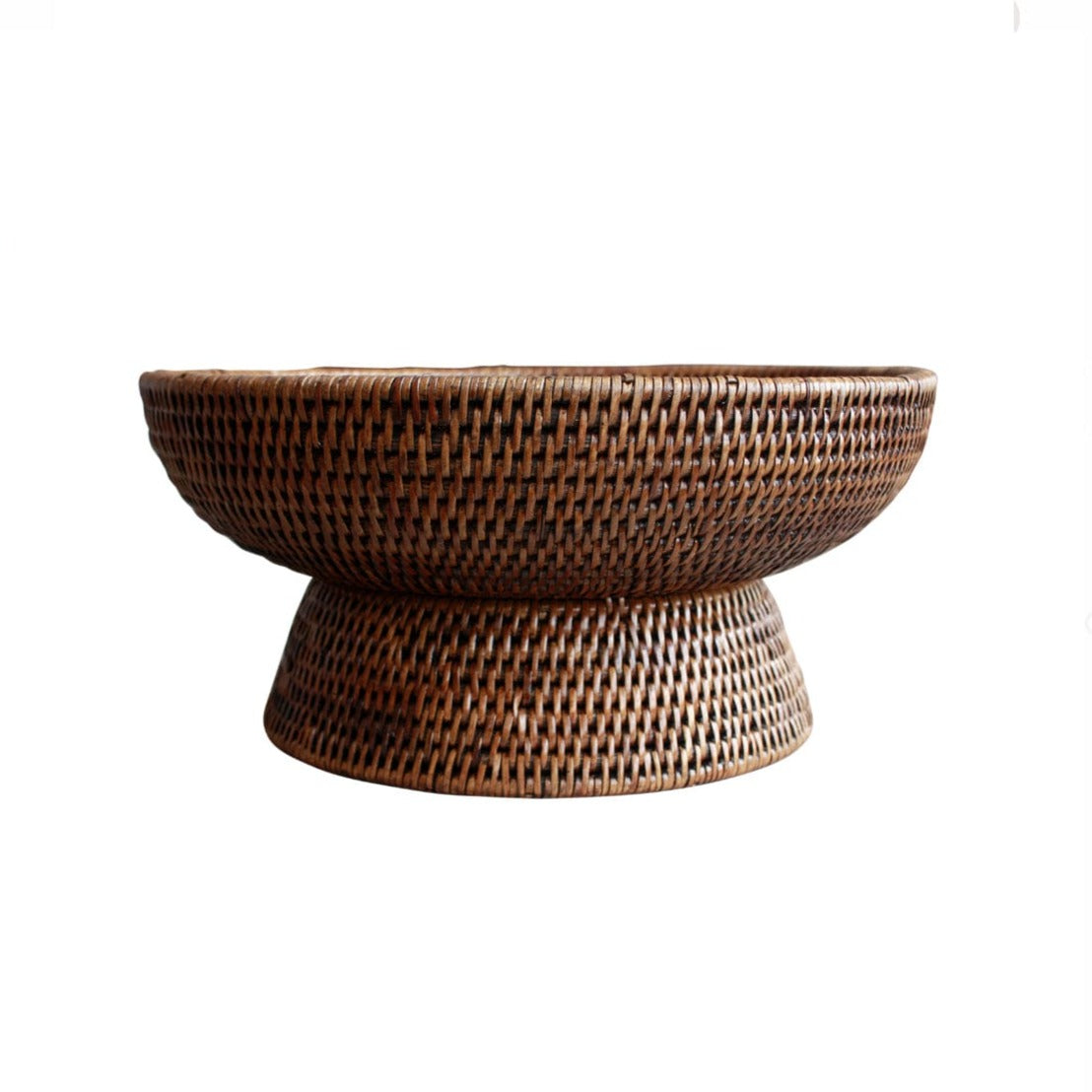A side view of a brown rattan fruit bowl.