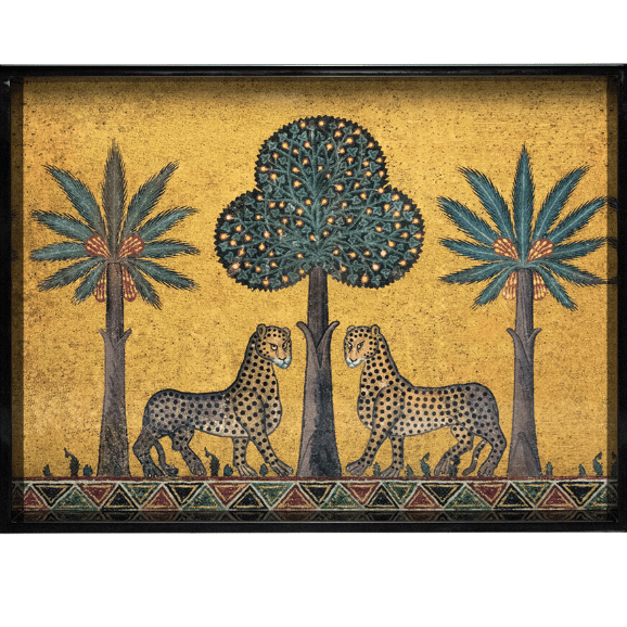 A hand-made lacquer serving tray with two leopards and three trees on a golden hue background.