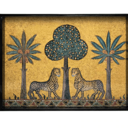 A medium sized serving tray with two leopards and three trees on a golden hue background.
