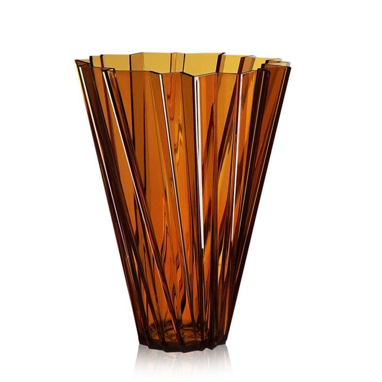 A transparent vase in the colour Ambra by Kartell.